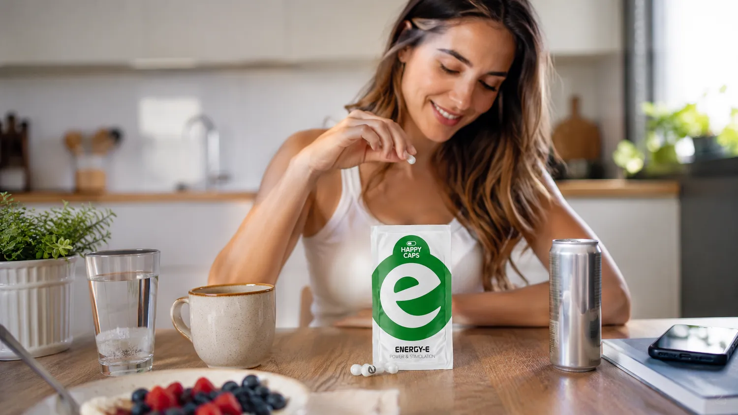 Natural energy capsules next to coffee cup and energy drink can on a bright lifestyle desk scene